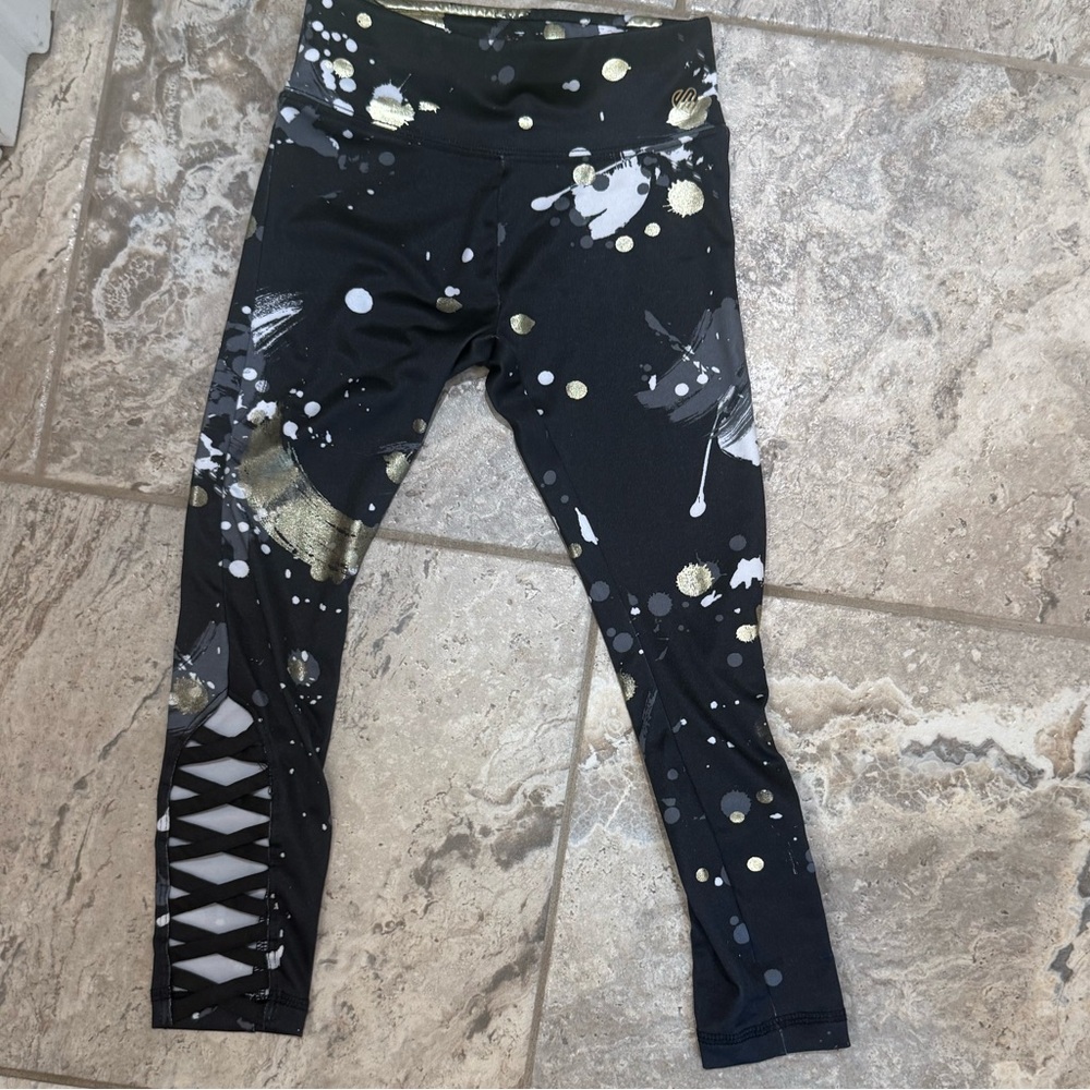 Like New Size XSmall Justice Black Leggings with gold  Design
